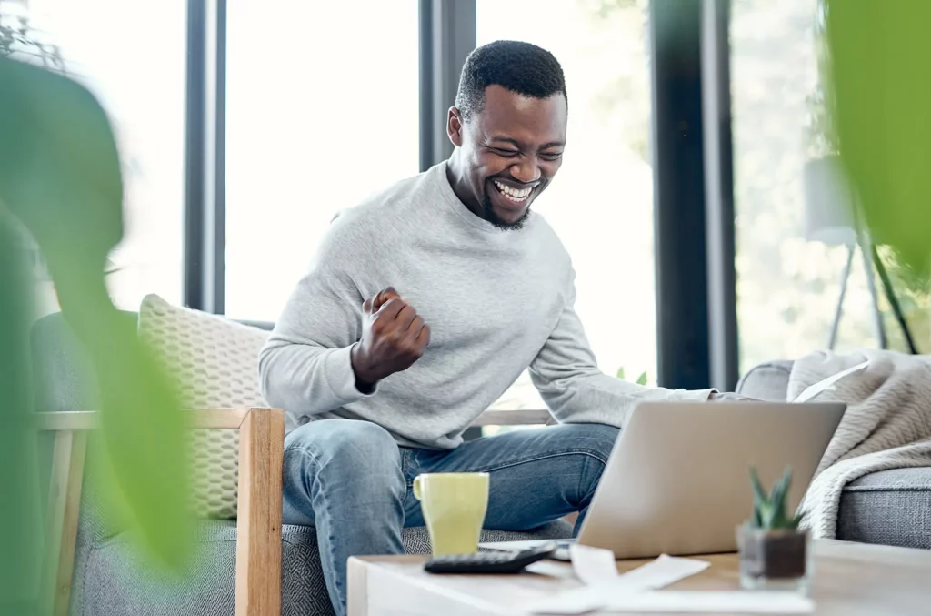 happy man on laptop