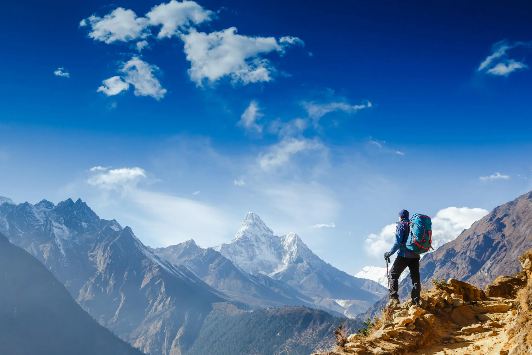 man climbing mountain